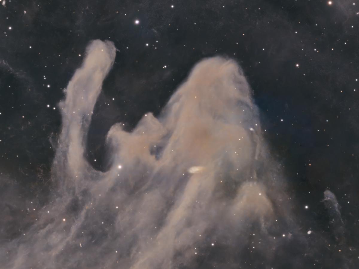 Close-up of the dust plumes of LBN 1320, a leaning central column with a raised tendril beside it forming a falling, human-like silhouette