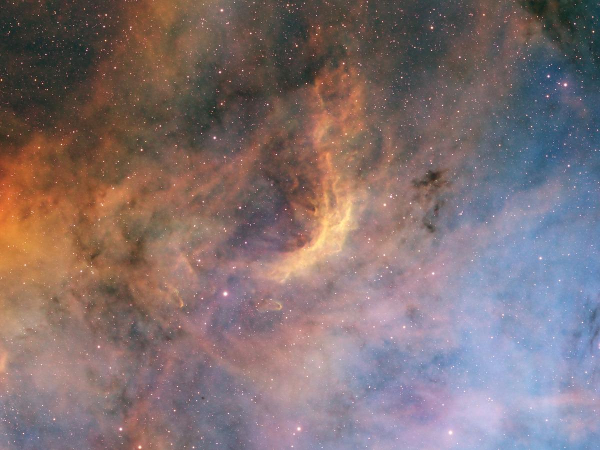 Close-up of the North America Nebula, ridges of ionised gas separated by winding dark dust lanes